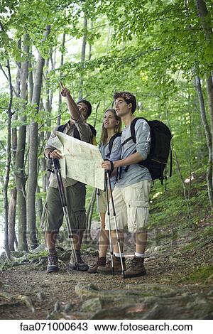 Hikers consulting map View Large Photo Image Stock Image - Hikers consulting map. Fotosearch