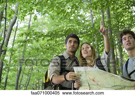 Hikers consulting map View Large Photo Image Stock Photography - Hikers consulting map. Fotosearch