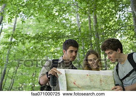 Hikers consulting map View Large Photo Image Stock Photography - Hikers consulting map. Fotosearch