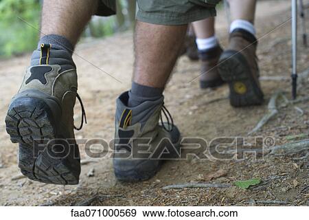 Hikers walking on path, close-up of feet View Large Photo Image Stock Photo - Hikers walking on path, close-up of feet. Fotosearch