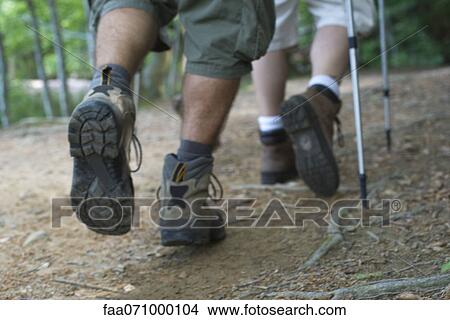 Hikers walking on path, cropped View Large Photo Image Picture - Hikers walking on path, cropped. Fotosearch