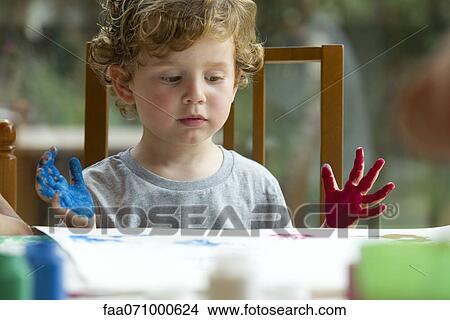 Little boy finger painting View Large Photo Image Picture - Little boy finger painting. Fotosearch