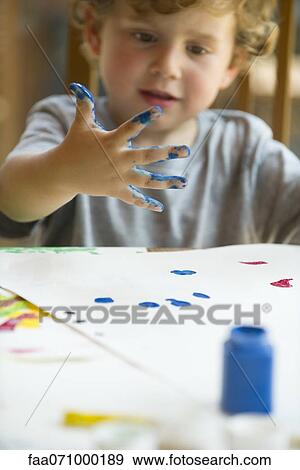 Little boy finger painting View Large Photo Image Stock Photo - Little boy finger painting. Fotosearch