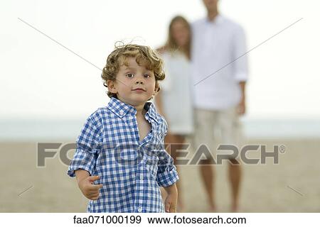 Stock Photo - Little boy running at the beach. Fotosearch