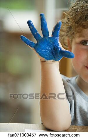 Little boy with hand covered in paint View Large Photo Image Stock Photo - Little boy with hand covered in paint. Fotosearch