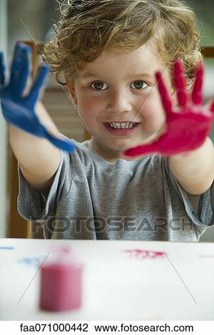 Little boy with hands covered in paint View Large Photo Image Stock Image - Little boy with hands covered in paint. Fotosearch
