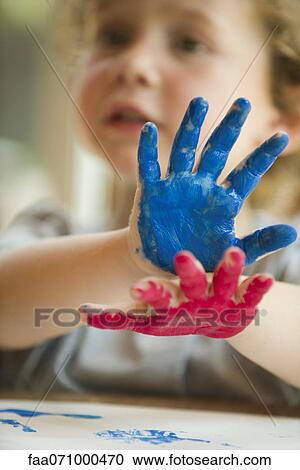 Little boy with hands covered in paint View Large Photo Image Stock Image - Little boy with hands covered in paint. Fotosearch