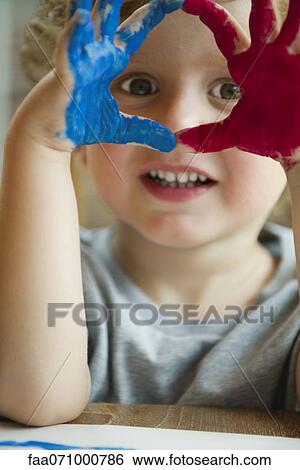 Little boy with hands covered in paint View Large Photo Image Stock Photograph - Little boy with hands covered in paint. Fotosearch
