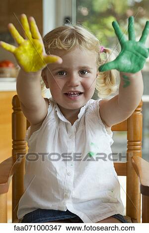 Little girl with paint on her hands View Large Photo Image Stock Photo - Little girl with paint on her hands. Fotosearch