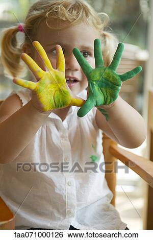 Little girl with paint on her hands View Large Photo Image Stock Photograph - Little girl with paint on her hands. Fotosearch