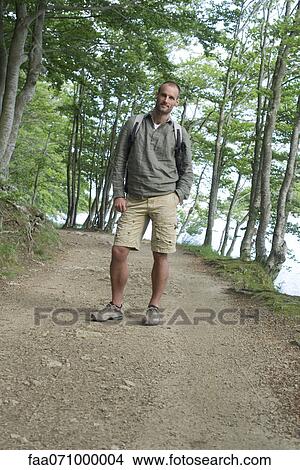Man hiking in woods View Large Photo Image Picture - Man hiking in woods. Fotosearch