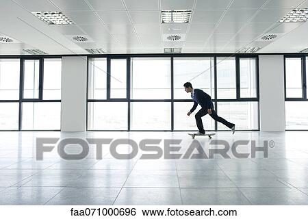 Man skateboarding indoors View Large Photo Image Stock Photograph - Man skateboarding indoors. Fotosearch