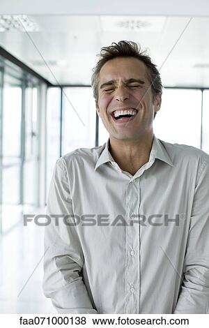 Man with eyes closed, laughing View Large Photo Image Stock Photo - Man with eyes closed, laughing. Fotosearch