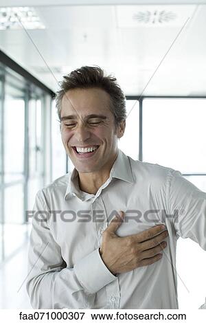 Man with eyes closed, laughing View Large Photo Image Stock Photo - Man with eyes closed, laughing. Fotosearch