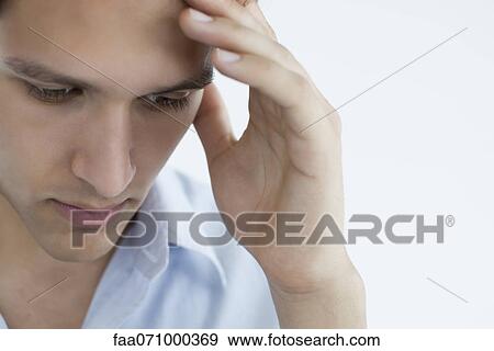 Man with hand on forehead View Large Photo Image Stock Photo - Man with hand on forehead. Fotosearch