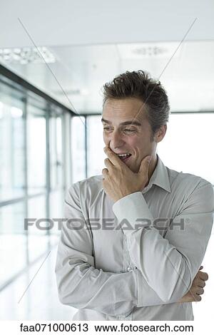 Man with hand under chin View Large Photo Image Stock Image - Man with hand under chin. Fotosearch