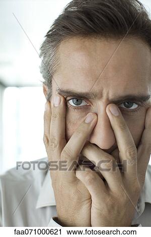 Man with hands covering face View Large Photo Image Stock Image - Man with hands covering face. Fotosearch