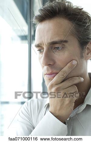 Stock Photograph - Man with sad expression. Fotosearch