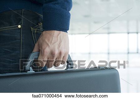 Man's hand holding briefcase View Large Photo Image Picture - Man's hand holding briefcase. Fotosearch