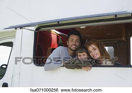 Parents and young boy in motor home, portrait View Large Photo Image Stock Photograph - Parents and young boy in motor home, portrait. Fotosearch