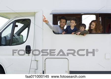 Parents and young boys in motor home, father pointing into distance View Large Photo Image Stock Photography - Parents and young boys in motor home, father pointing into distance. Fotosearch