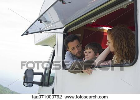 Parents and young son by motor home window View Large Photo Image Stock Image - Parents and young son by motor home window. Fotosearch