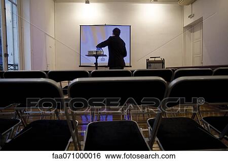 Person preparing overhead projector in conference room View Large Photo Image Stock Photograph - Person preparing overhead projector in conference room. Fotosearch