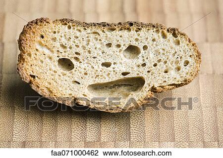 Piece of whole wheat bread with smiley face View Large Photo Image Stock Image - Piece of whole wheat bread with smiley face. Fotosearch