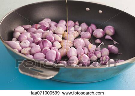 Preparing shallots in pan View Large Photo Image Stock Photo - Preparing shallots in pan. Fotosearch