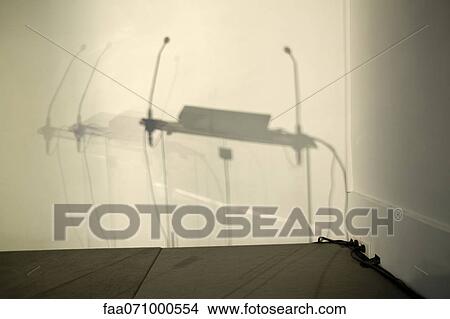 Shadow of podium on conference room wall View Large Photo Image Picture - Shadow of podium on conference room wall. Fotosearch