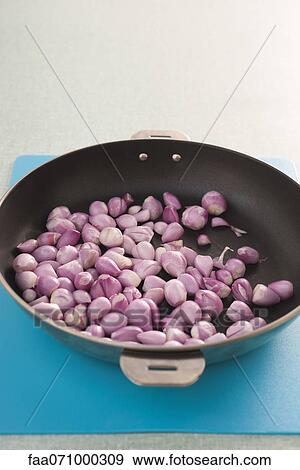 Shallots in pan View Large Photo Image Stock Photo - Shallots in pan. Fotosearch