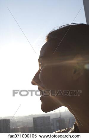 Silhouette of woman looking at view, smiling View Large Photo Image Stock Photography - Silhouette of woman looking at view, smiling. Fotosearch