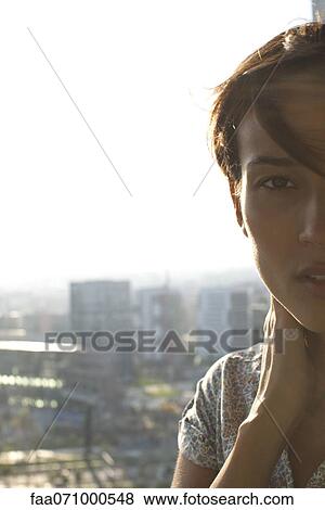 Silhouette of woman with hand on neck, cropped View Large Photo Image Stock Photo - Silhouette of woman with hand on neck, cropped. Fotosearch