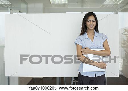 Smiling woman in office View Large Photo Image Stock Photography - Smiling woman in office. Fotosearch