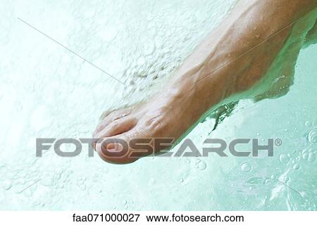 Stock Photo - Testing the water. Fotosearch