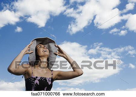Stock Photograph - Woman enjoying outdoors. Fotosearch