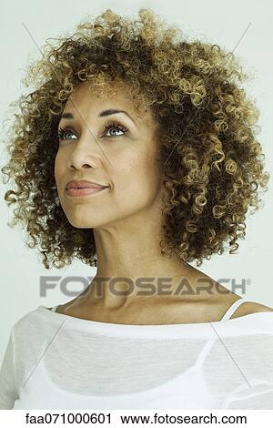 Woman looking up optimistically, portrait View Large Photo Image Stock Image - Woman looking up optimistically, portrait. Fotosearch