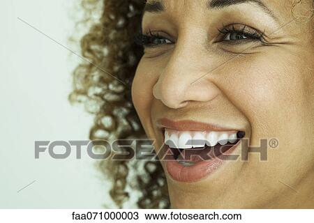 Woman smiling, close-up View Large Photo Image Stock Image - Woman smiling, close-up. Fotosearch