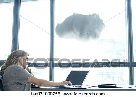 Woman using laptop computer. cloud above laptop computer View Large Photo Image Stock Photograph - Woman using laptop computer. cloud above laptop computer. Fotosearch