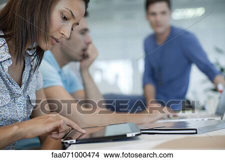 Woman using tablet computer View Large Photo Image Picture - Woman using tablet computer. Fotosearch