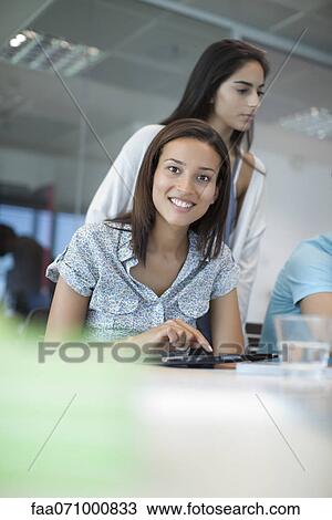 Woman using tablet computer View Large Photo Image Stock Image - Woman using tablet computer. Fotosearch