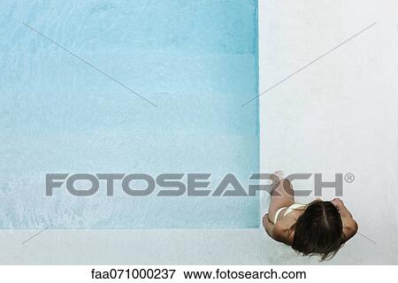 Woman wading into pool View Large Photo Image Stock Photo - Woman wading into pool. Fotosearch