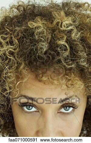 Stock Image - Woman with look of determination, cropped. Fotosearch