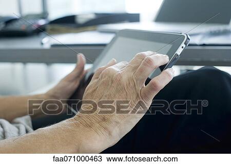 Woman's hand touching digital tablet screen View Large Photo Image Stock Image - Woman's hand touching digital tablet screen. Fotosearch