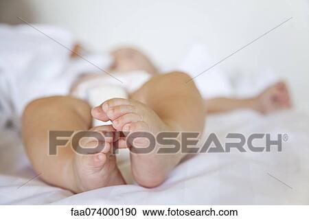 Baby's bare feet View Large Photo Image Stock Image - Baby's bare feet. Fotosearch