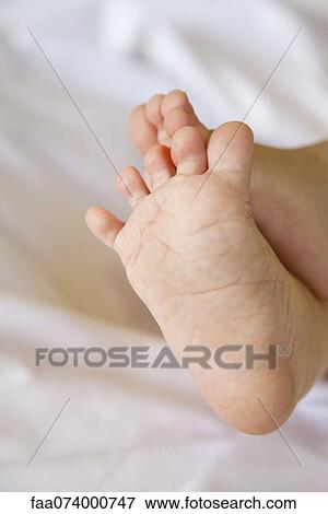 Baby's bare feet View Large Photo Image Stock Photo - Baby's bare feet. Fotosearch
