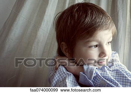 Boy daydreaming, portrait View Large Photo Image Stock Photo - Boy daydreaming, portrait. Fotosearch