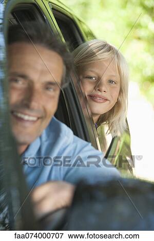 Boy riding in car with father, leaning out window and smiling at camera View Large Photo Image Stock Photo - Boy riding in car with father, leaning out window and smiling at camera. Fotosearch