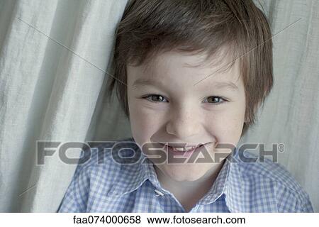 Boy smiling at camera, portrait View Large Photo Image Stock Photo - Boy smiling at camera, portrait. Fotosearch