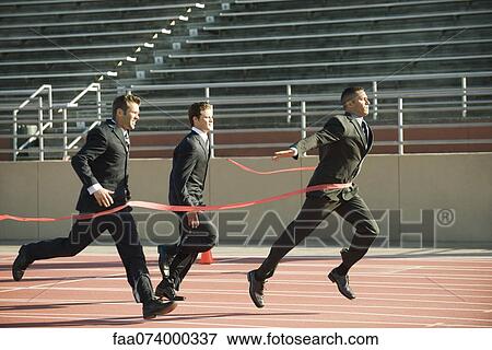 Businessman crossing finish line in race View Large Photo Image Stock Photo - Businessman crossing finish line in race. Fotosearch